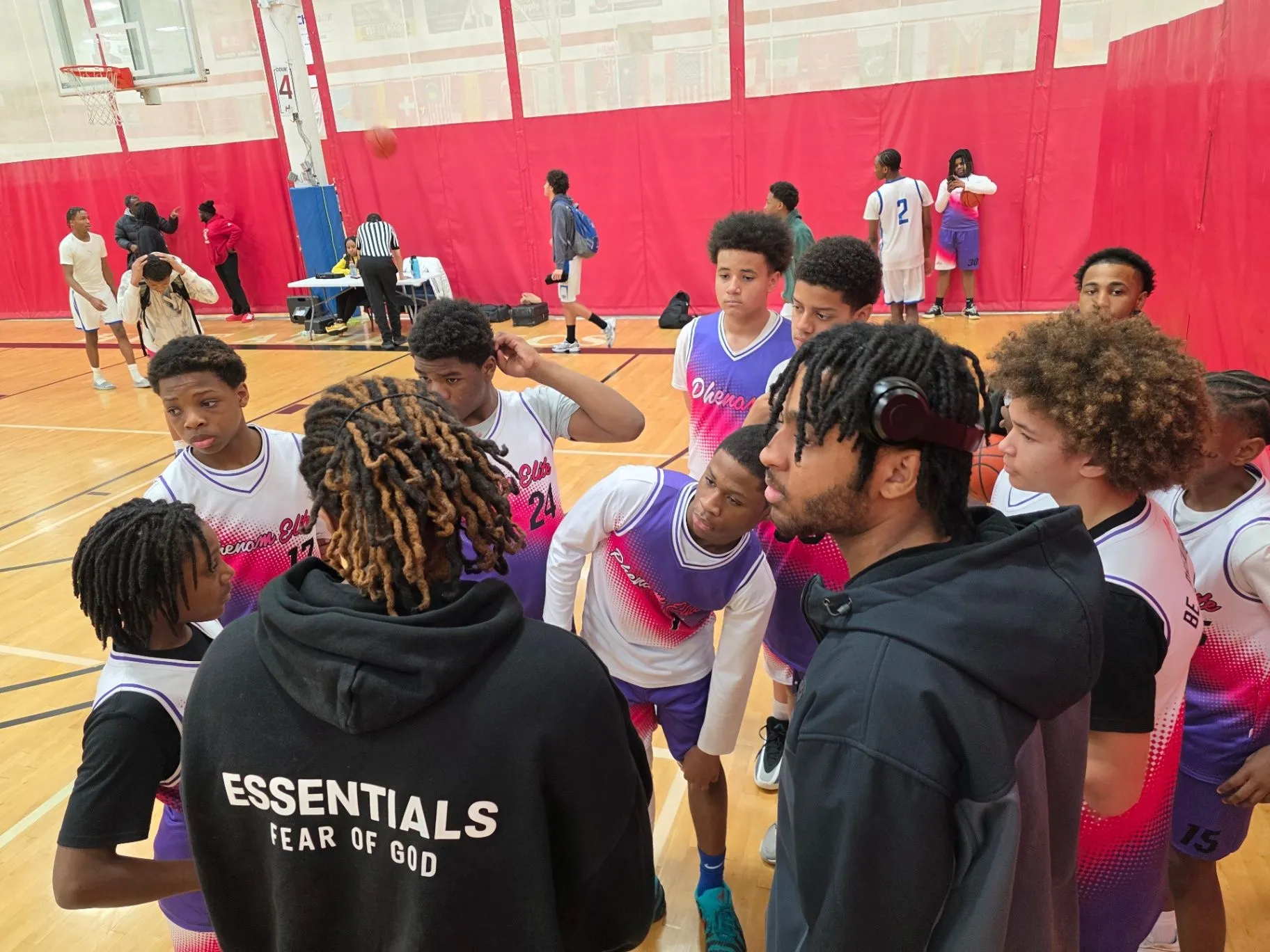 Phenom Elite player stands alongside a competitor after the play